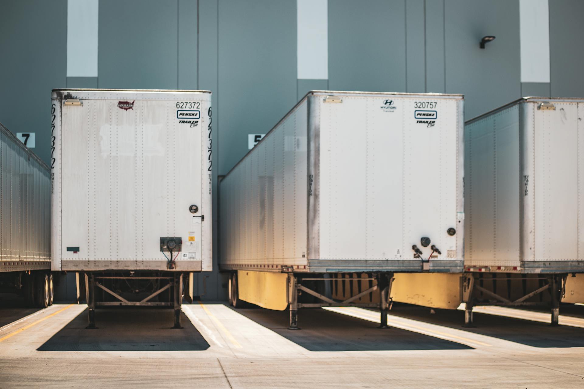 Truck at a weigh scale near a yard gate